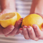 woman holding lemons